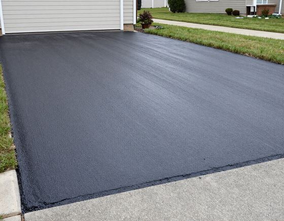 Sealer being applied to a residential driveway in Kingsport, TN