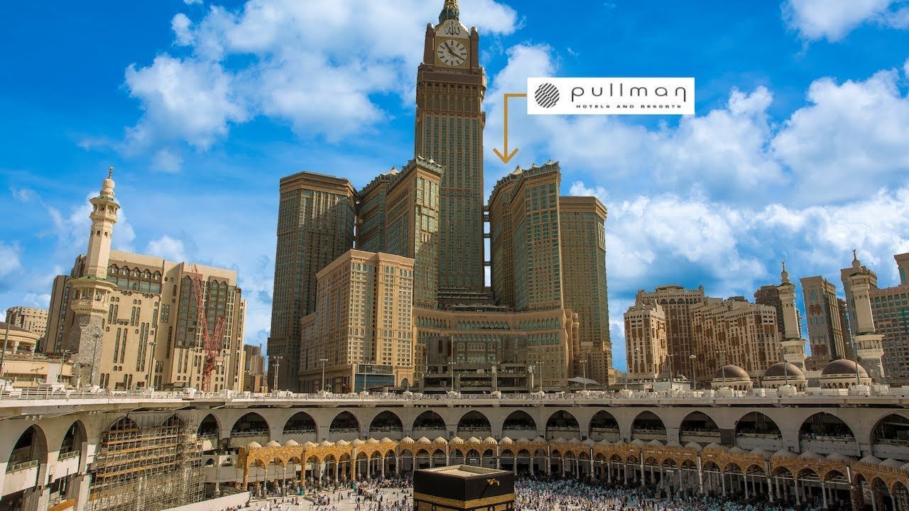 Mecca, Saudi Arabia: Grand Mosque with Clock Tower and Pullman hotel, crowds gather.