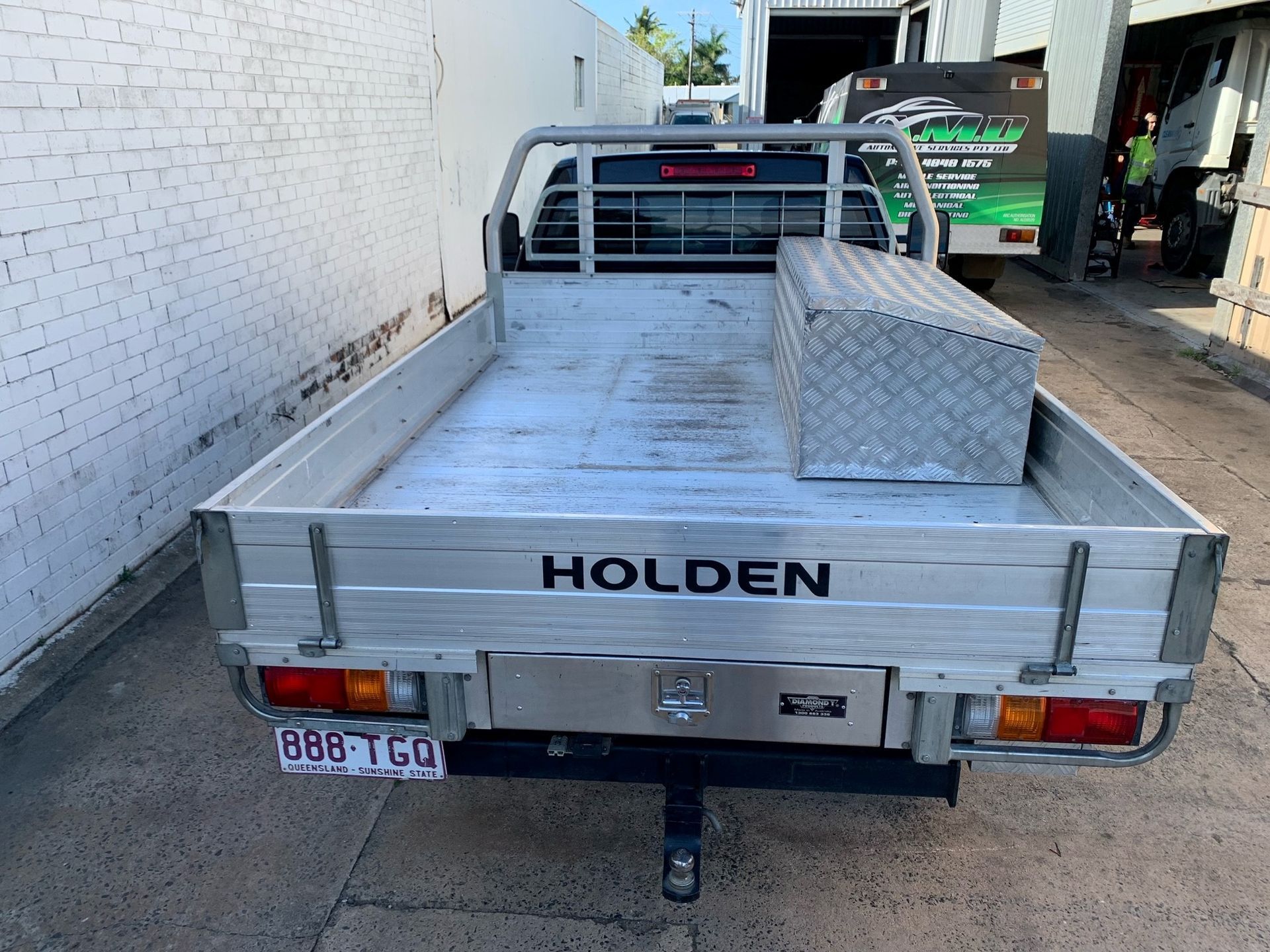 Rear View of a Silver Holden Utility Truck With a Tool Box in the Bed — A.M.D. Automotive Services in Mackay, QLD