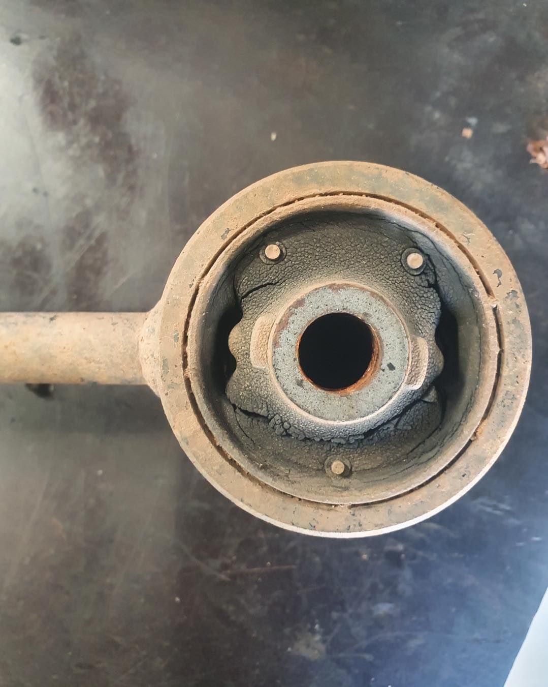 Rusty Suspension Component With a Worn Rubber Bushing — A.M.D. Automotive Services in Bowen, QLD