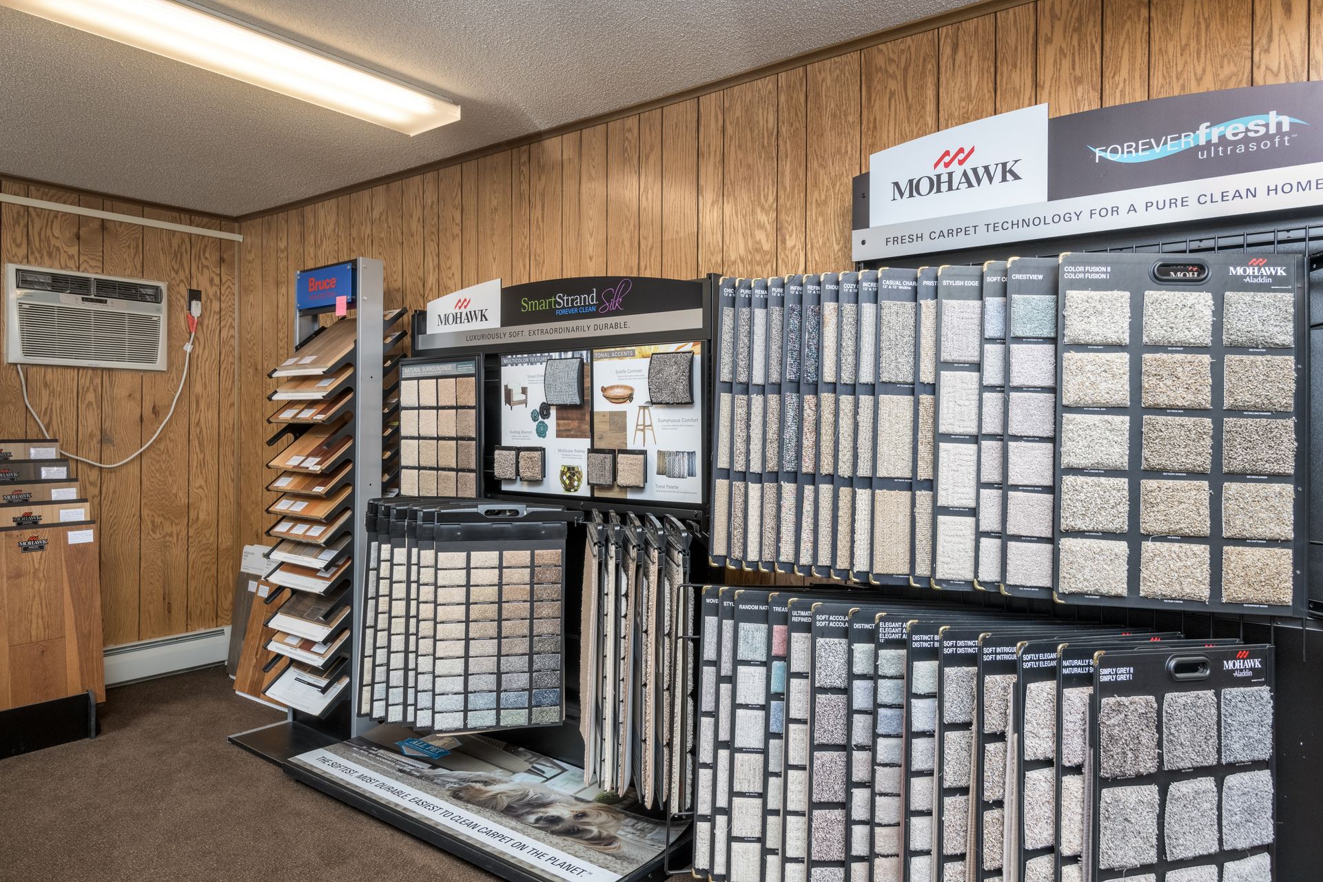 There are many different types of carpets on display in this room.
