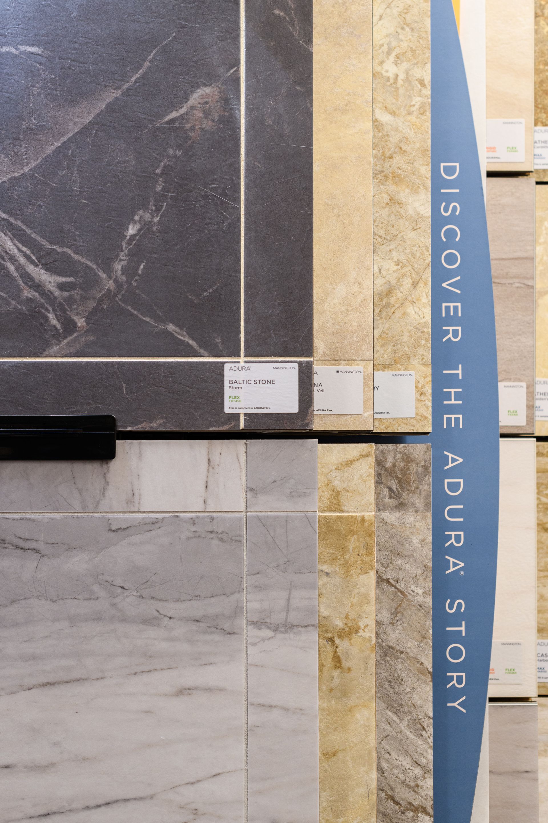 A sign in a store that says discover the adura story