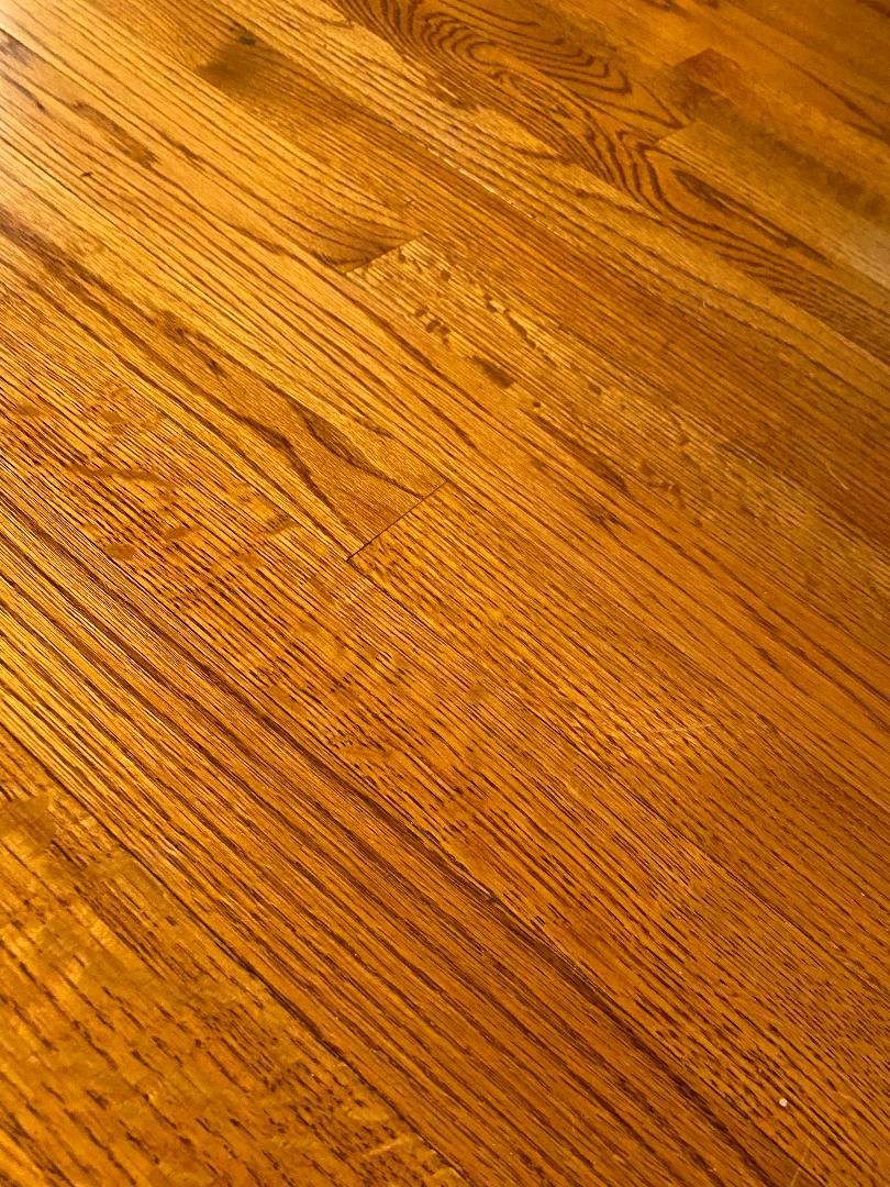A close up of a wooden floor with a lot of grain.