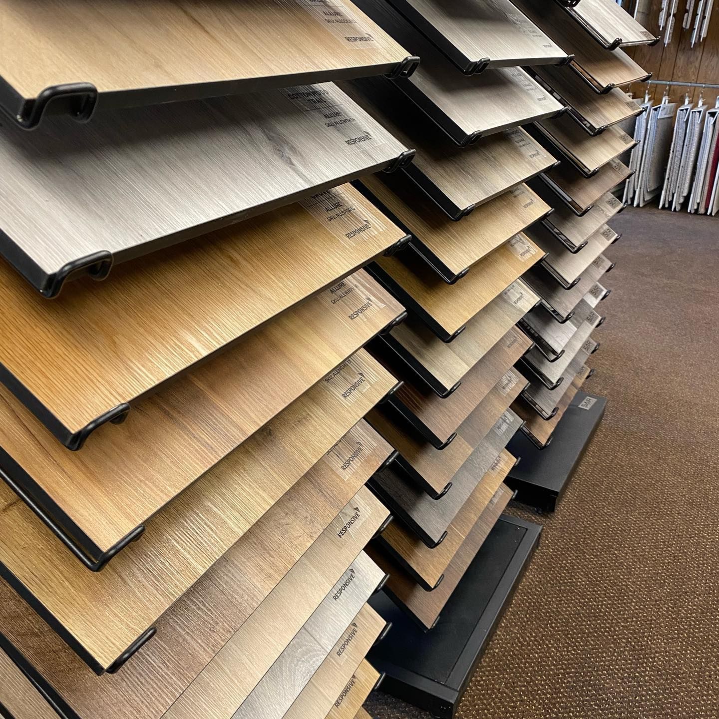 A display of wooden flooring samples in a store