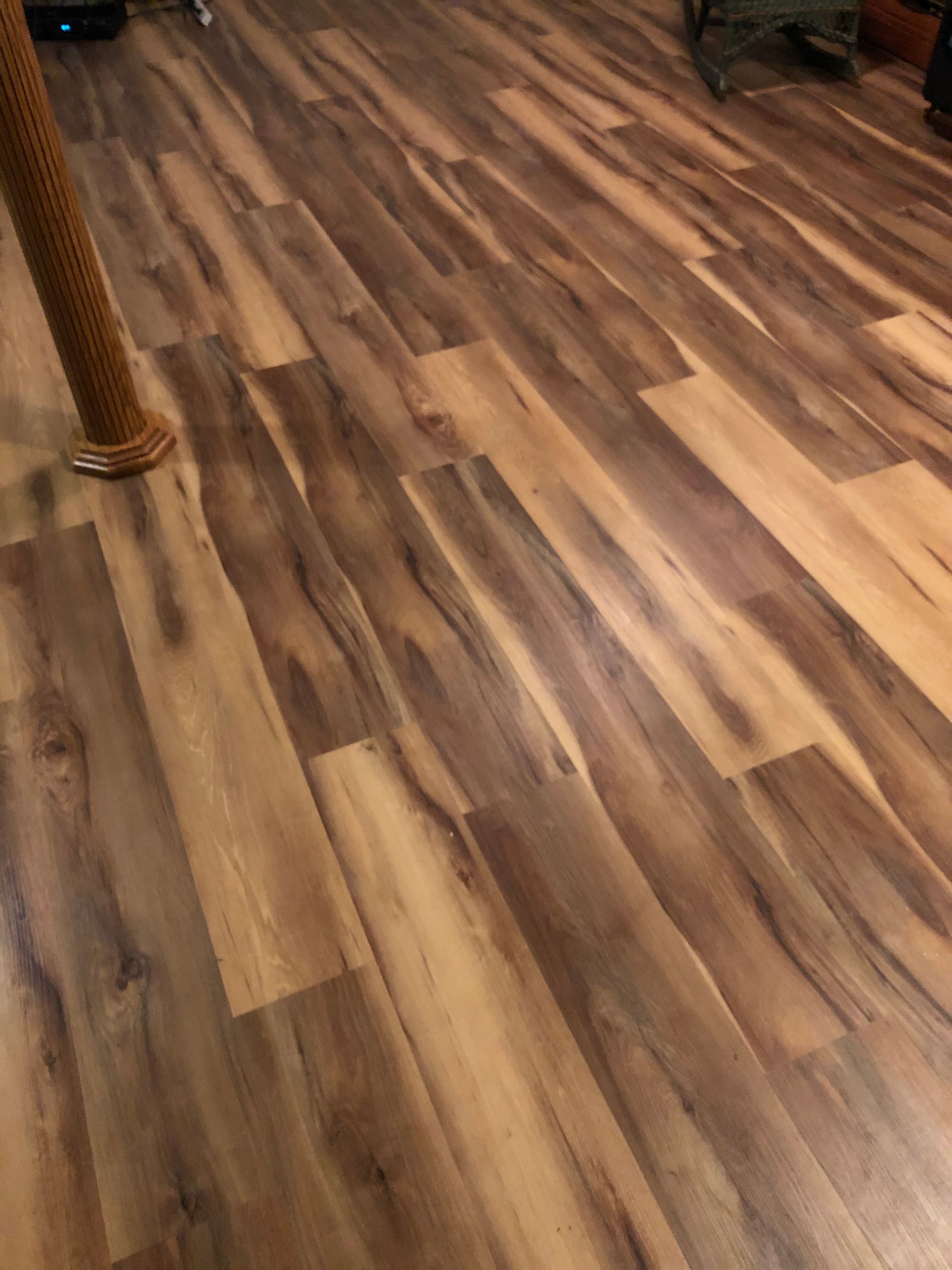 A close up of a wooden floor in a living room.
