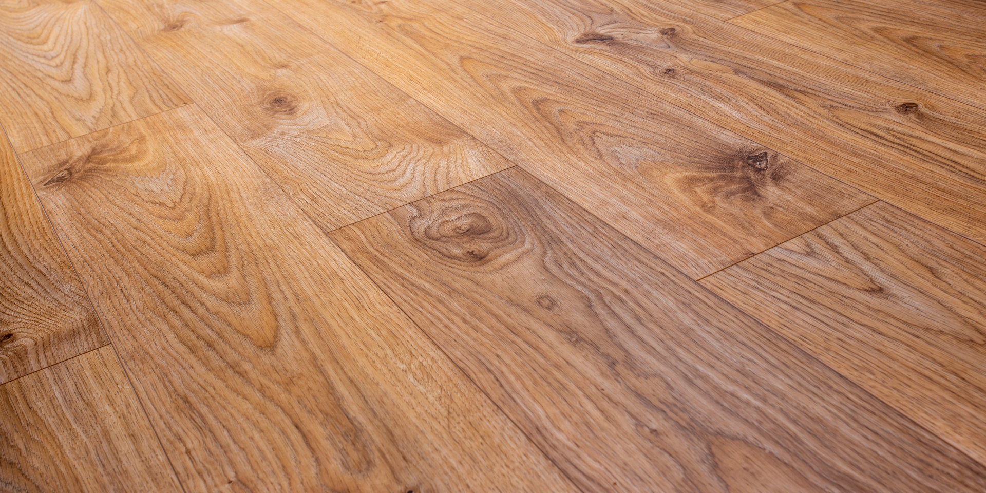 A close up of a wooden floor in a room.