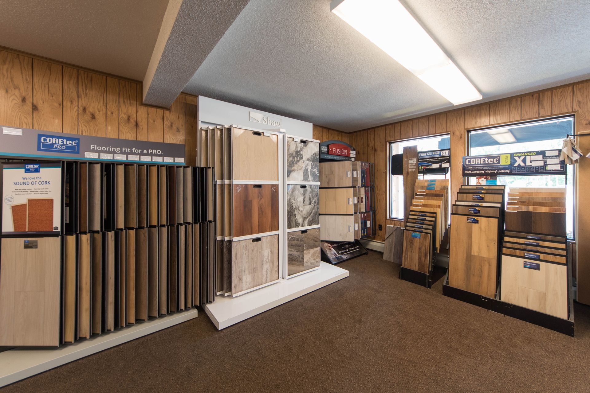 A room filled with lots of different types of wooden flooring.