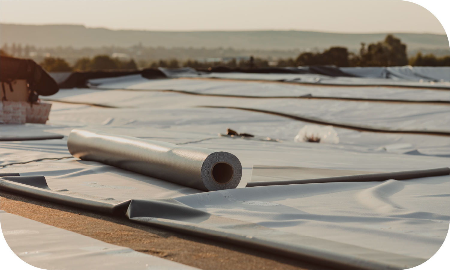 An attic with a pipe covered in aluminum foil