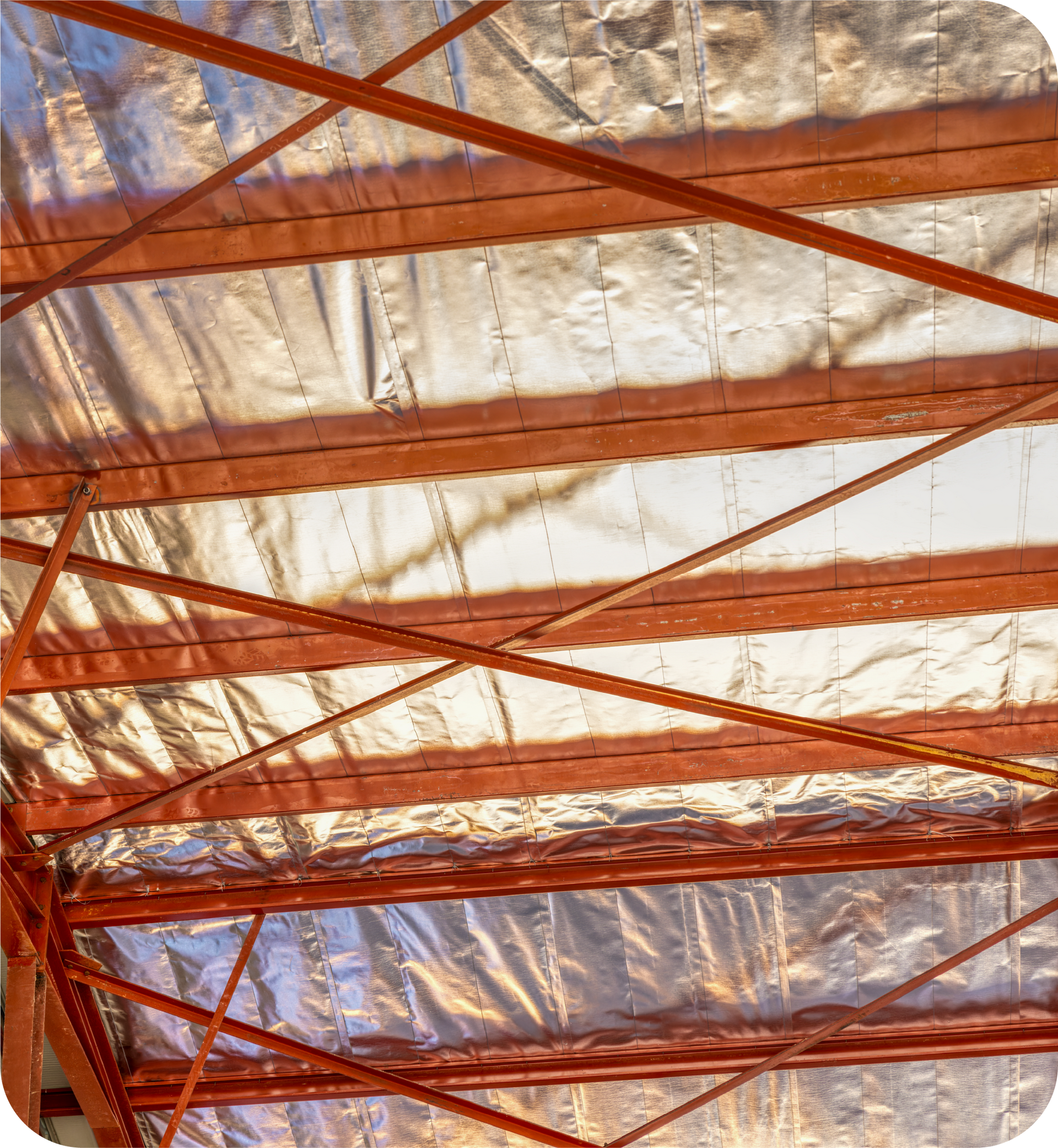 An attic with aluminum foil covering the ceiling