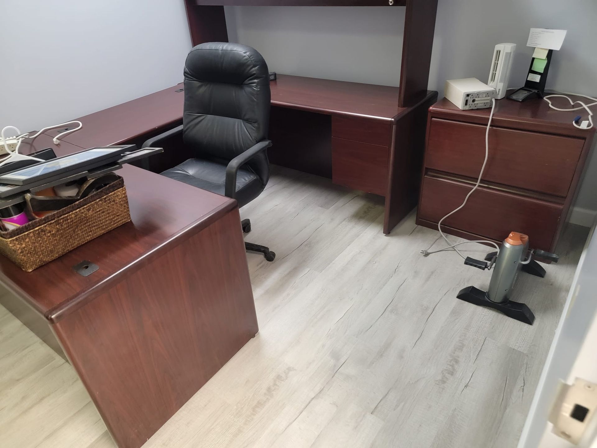 A desk with a chair and a computer on it