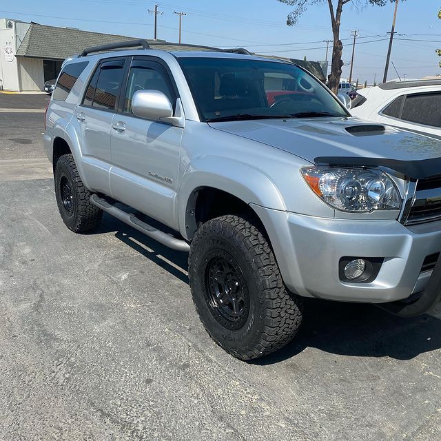 A silver suv in a parking lot
