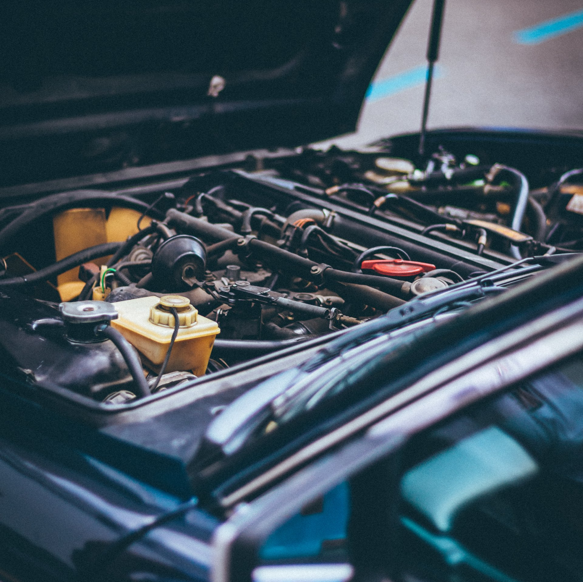Hood of a Car with exposed engine | JCR Performance: Sacramento’s Best Auto Repair Shop 