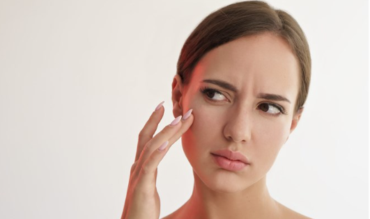Woman experiencing holiday stress affecting skin health