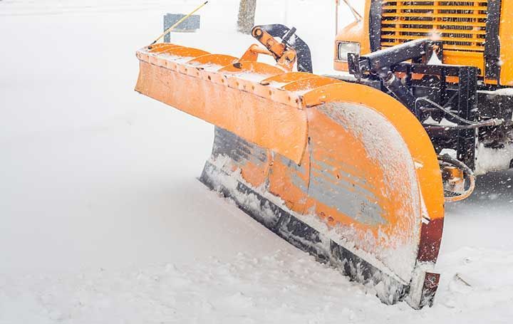 Snow plow doing snow removal