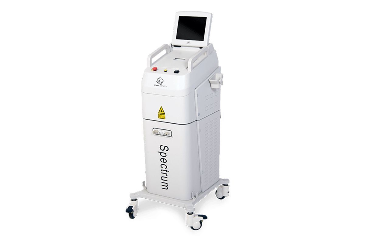 White "Spectrum" medical laser machine on wheels with a touchscreen display.