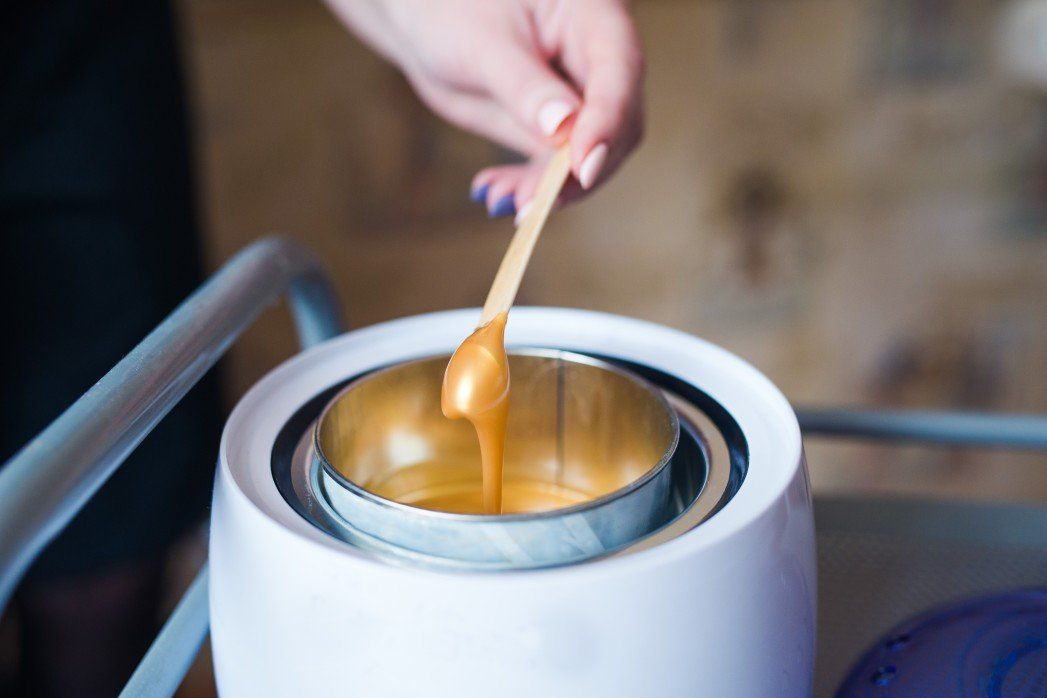 Photo of a leg getting waxed