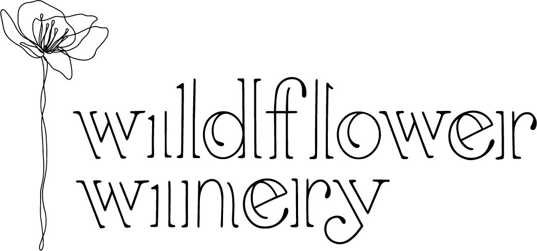 Logo for Wildflower Winery, featuring a floral illustration and text.