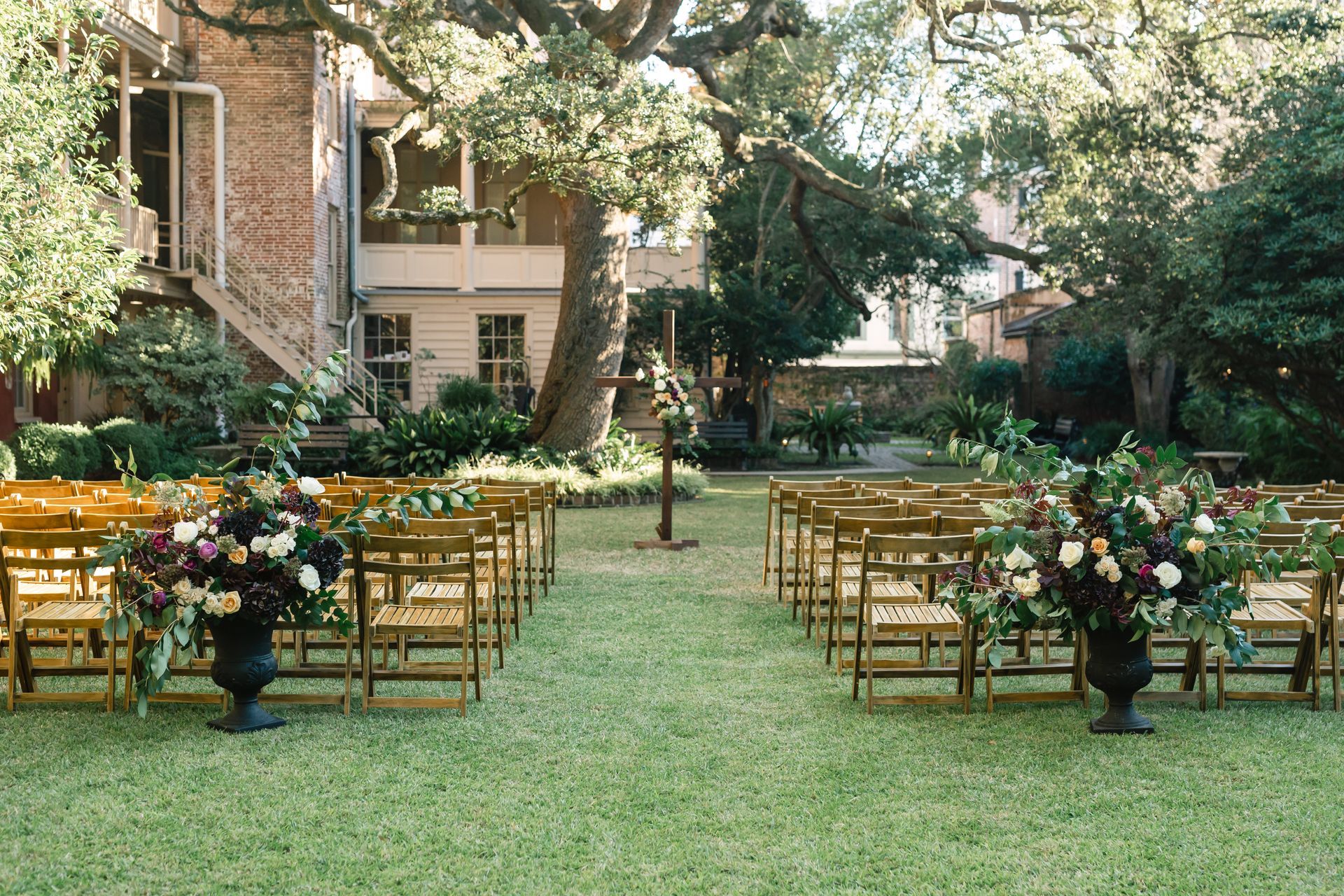 A large room with tables and chairs set up for a wedding reception.