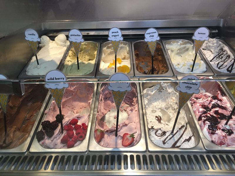 gelato flavours A display case filled with many different flavors of ice cream