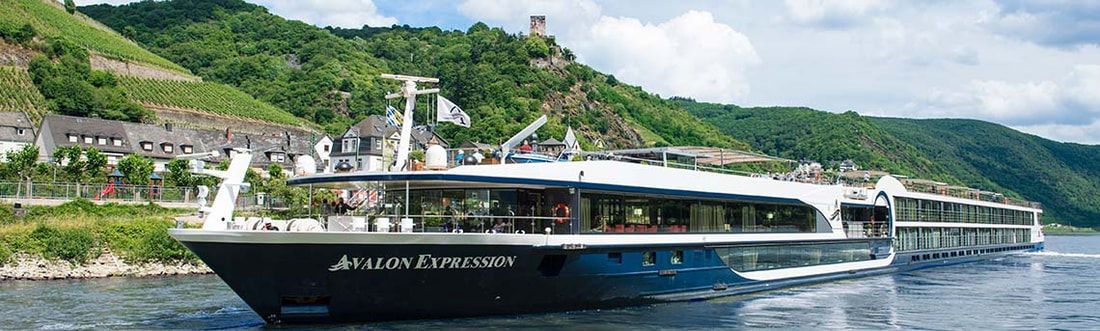ship going through canal in europe countryside. A large cruise ship is floating on top of a lake.