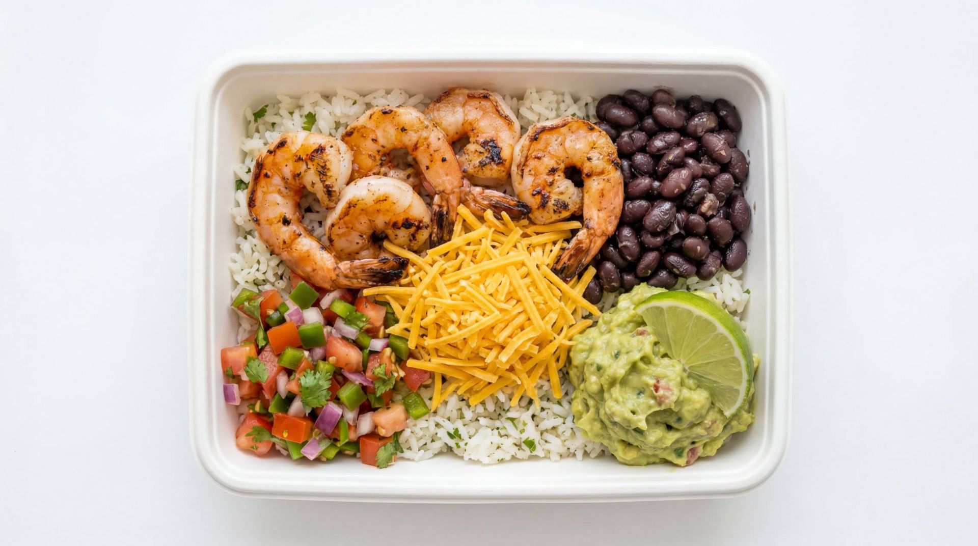 Shrimp burrito bowl with black beans, cheese, guacamole, and pico de gallo in a white container