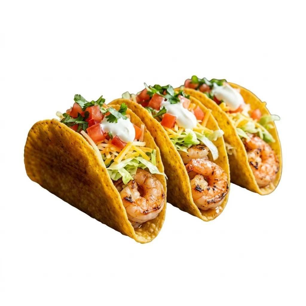 Three shrimp tacos with lettuce, tomato, cheese, and sour cream on a white background
