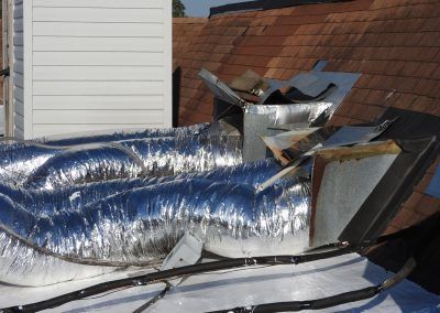 A roof with a bunch of ducts on it