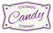 The colorado candy company logo is a purple and white sign.