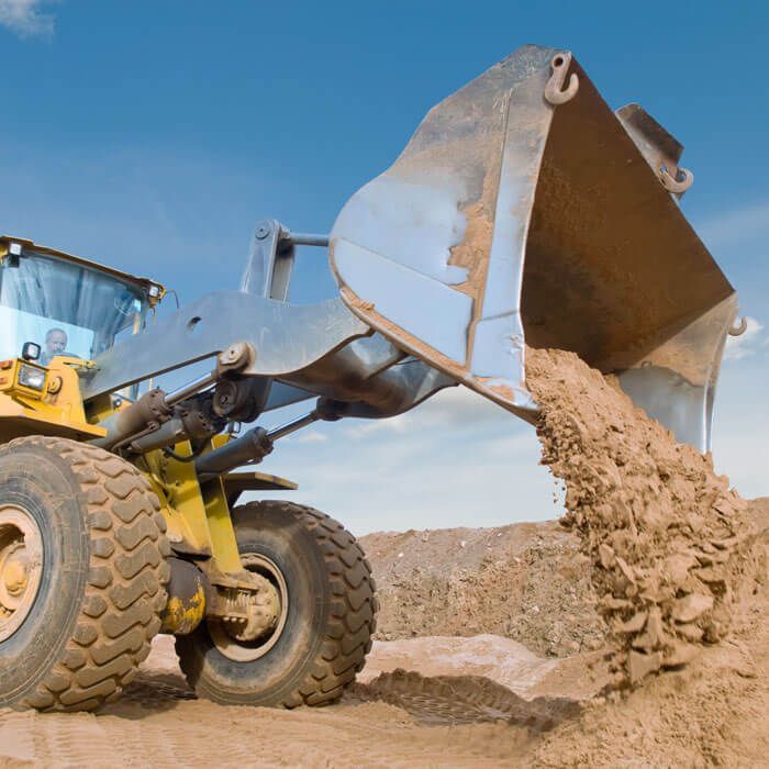 wheel loader dumping dirt