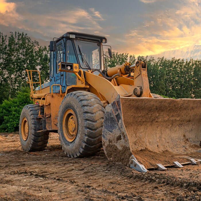 Bulldozer on a construction site in a forested area