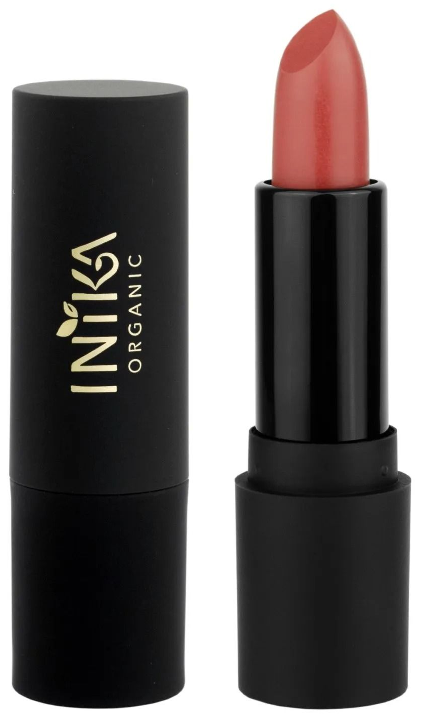 Zwarte lipstickhuls met een koraalkleurige tint naast de dop op een witte achtergrond.
