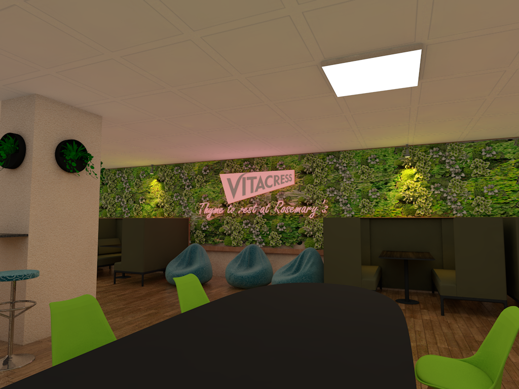 A room with a table and chairs and a green wall.