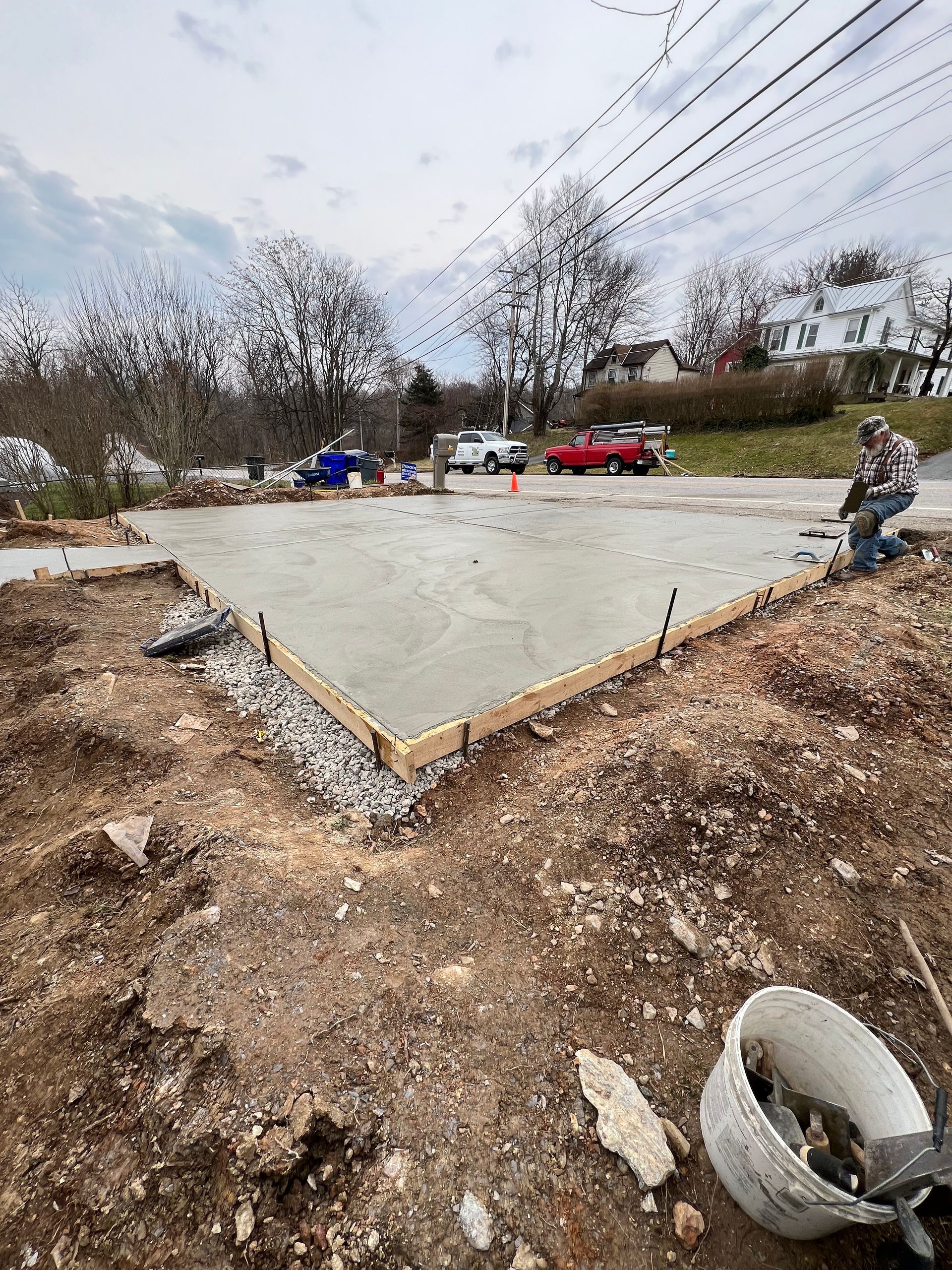 A concrete foundation is being built in a residential area.