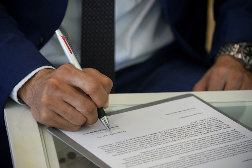 Businessman Signing Contract — Northern Accounting Solutions In Brisbane, QLD
