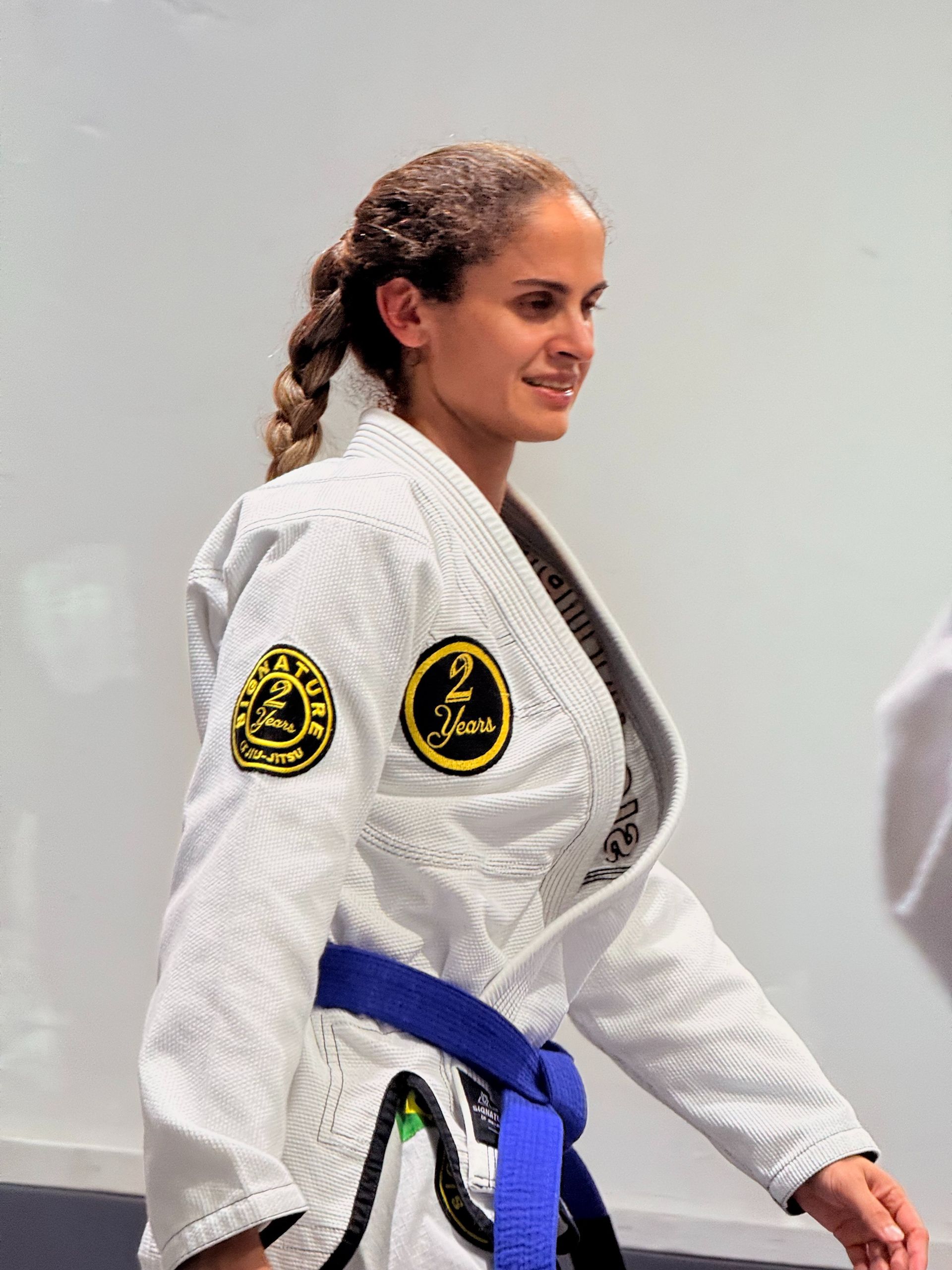 Adults drilling Brazilian Jiu-Jitsu techniques at Signature of Jiu-Jitsu in Belmont, CA for low-impact fitness.