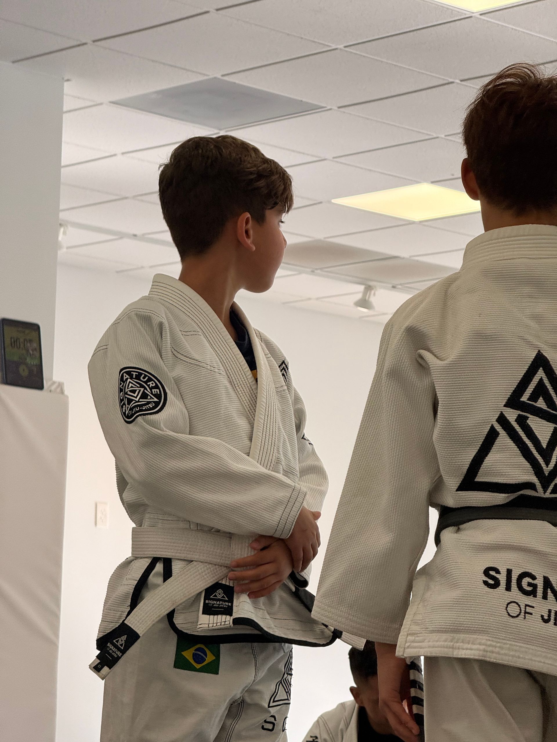 Kids practice safe grappling drills at Signature of Jiu-Jitsu in Belmont, CA.