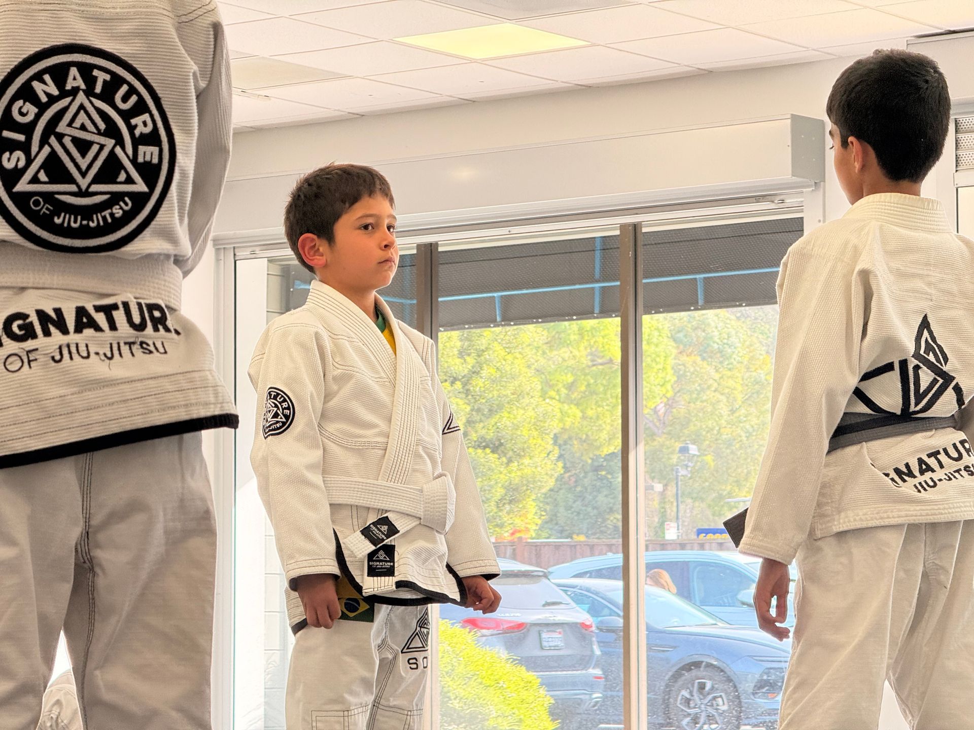 Kids practicing Youth Jiu-Jitsu drills at Signature of Jiu-Jitsu in Belmont, CA, building fitness and focus.