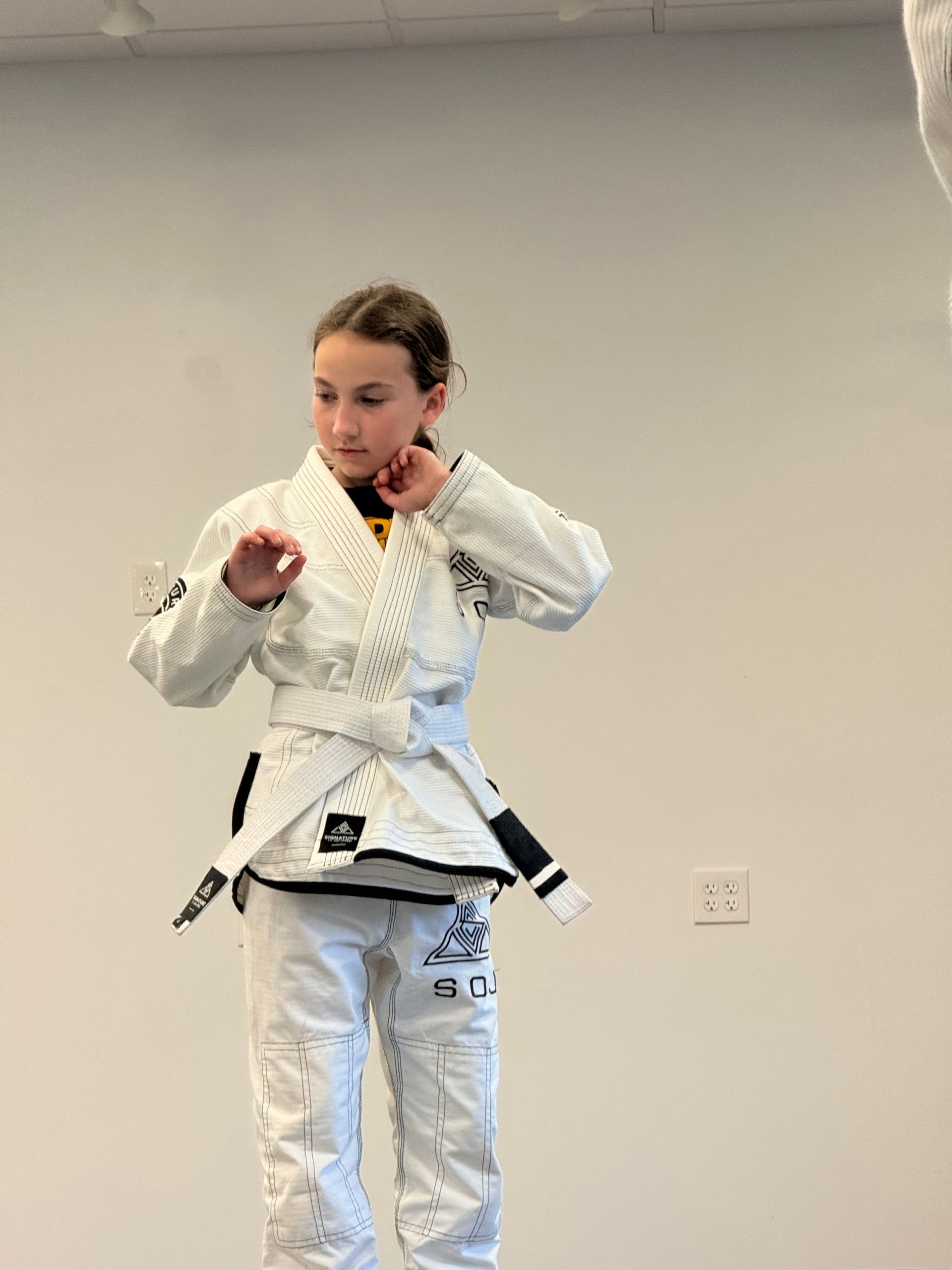 Kids practice safe grappling drills at Signature of Jiu-Jitsu in Belmont, CA, building fitness and focus.