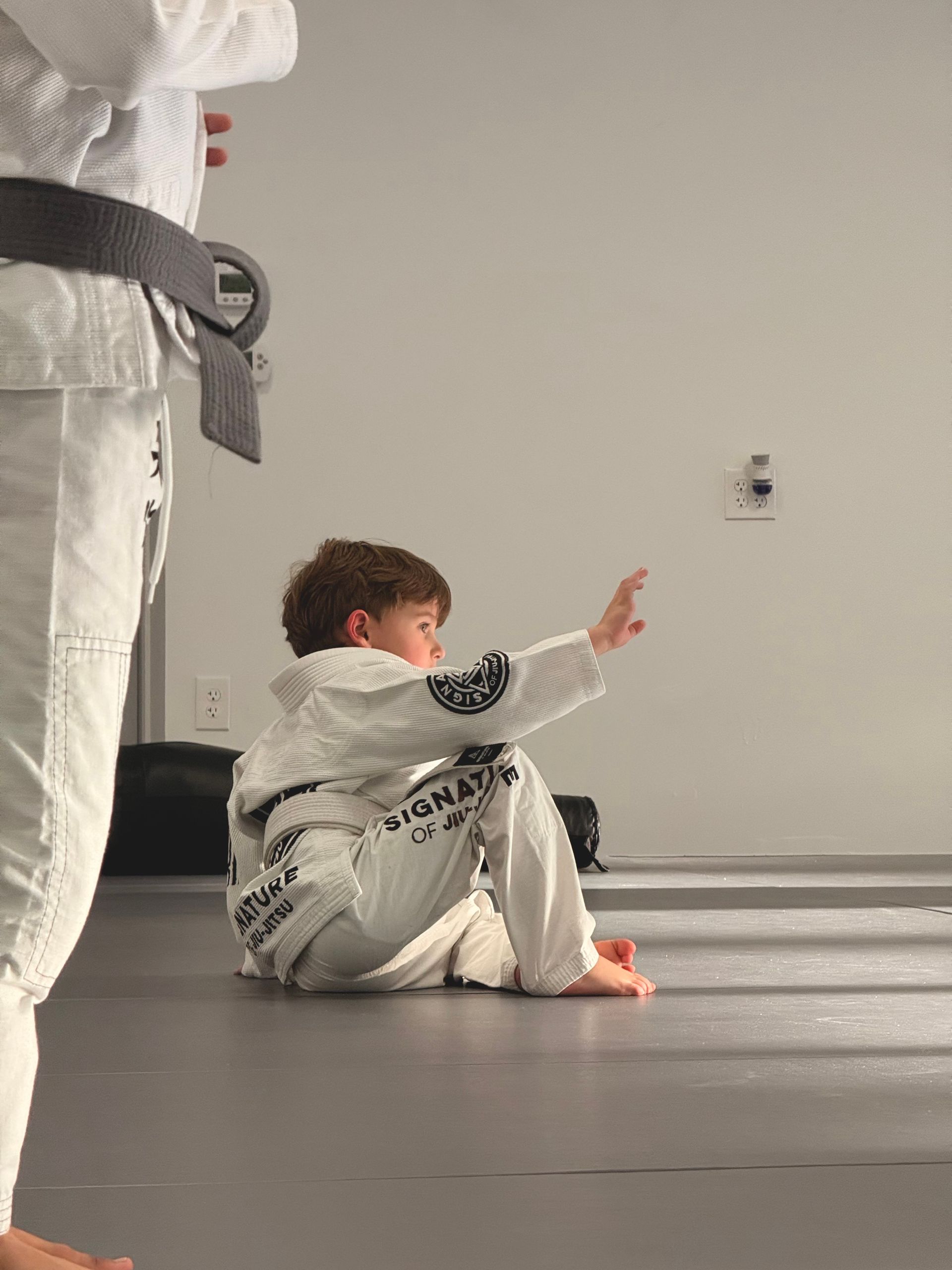 Kids practicing Youth Jiu-Jitsu at Signature of Jiu-Jitsu in Belmont, CA, building confidence and control
