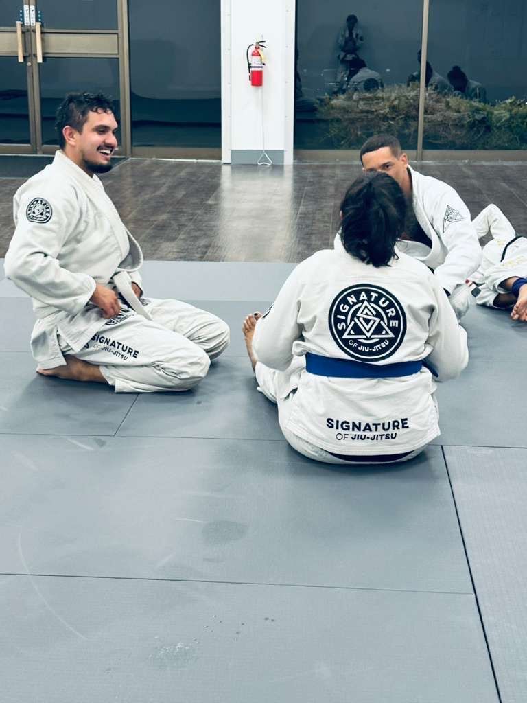 Students training Brazilian Jiu-Jitsu at Signature of Jiu-Jitsu in Belmont, CA to build fitness and calm.