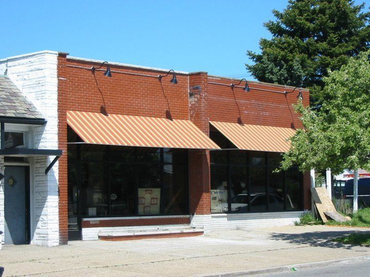 Two Wide Orange Stripes Awning — Roseville, MI — J.C. Goss Company