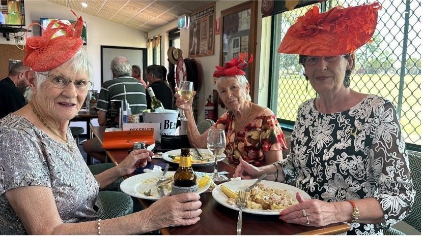 Four Ladies With Hats Sitting Aty A Table Eating Food— Maryborough Cricket Club In Maryborough, QLD