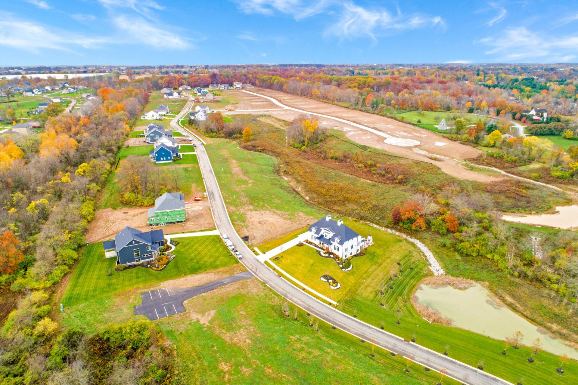 An aerial view of a residential area with houses and trees