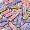 Pile of pink, lavender, and tan 