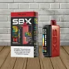 Box and device of SBX vape, ripe apple flavor. Red and black colors, digital display, warning label.