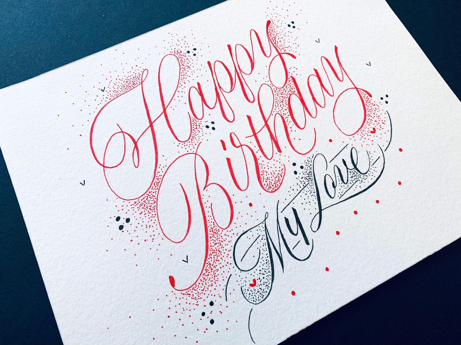 Hand-lettered greeting card with red