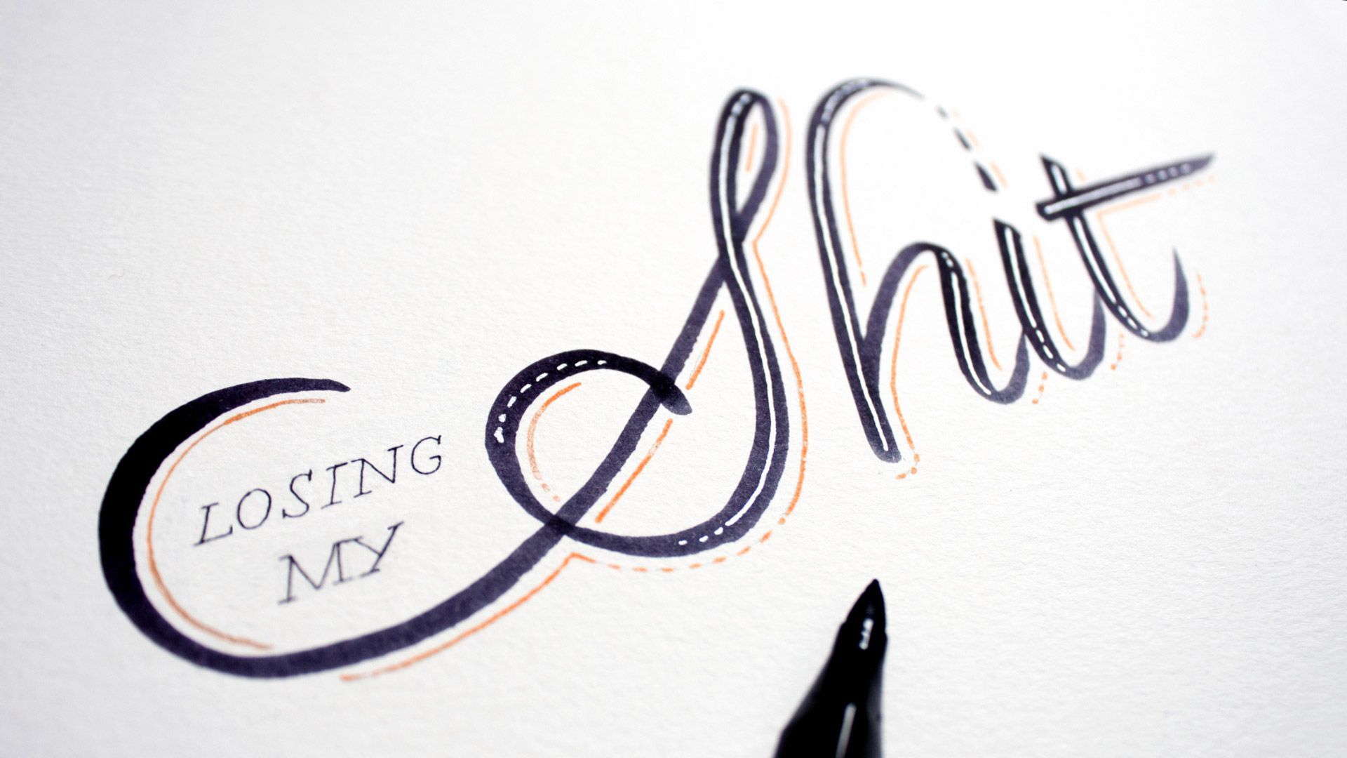 A hand-drawn artistic lettering piece on white paper with a black pen showing the phrase 