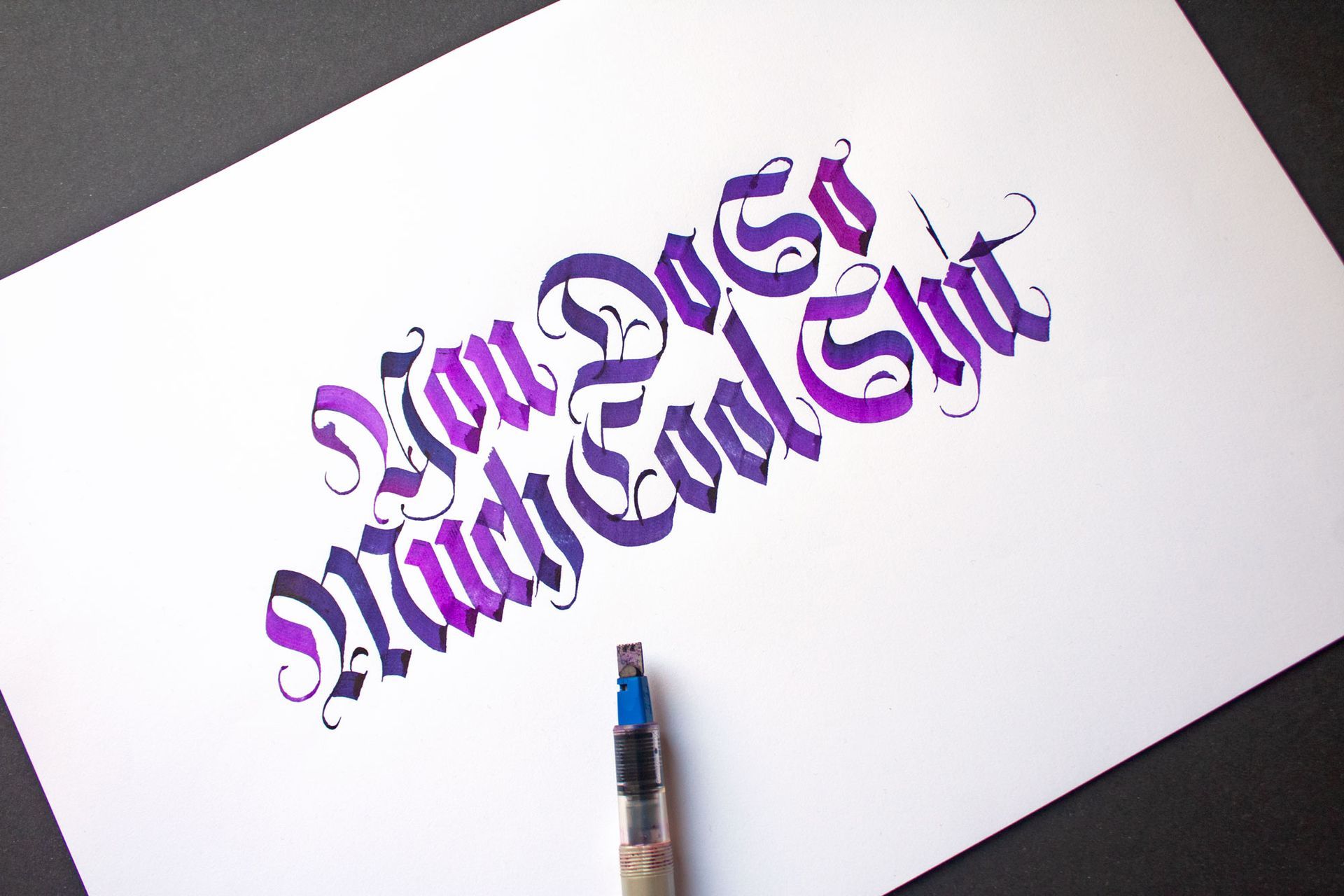 Calligraphy art written in purple ink on white paper reads