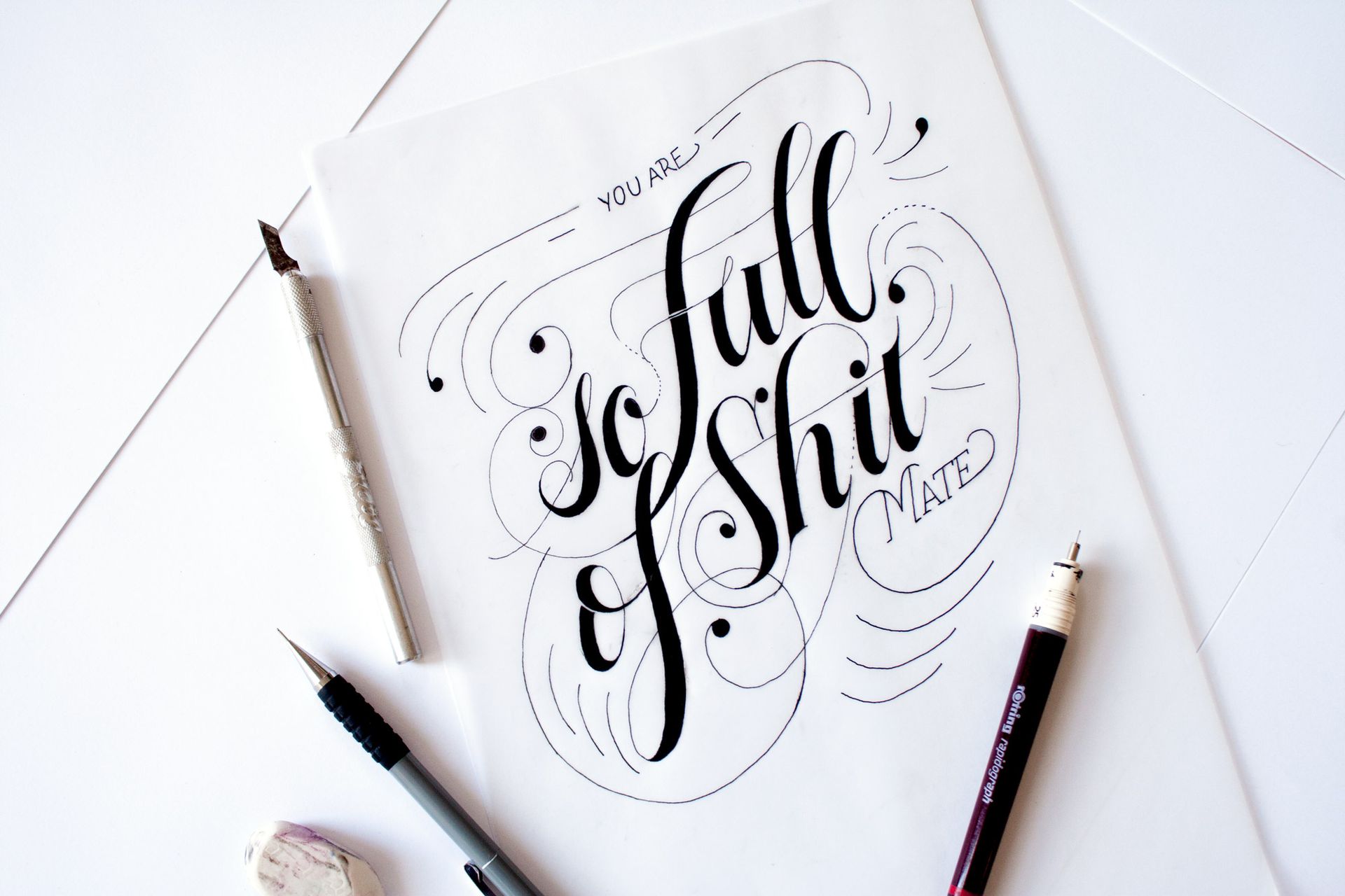 Calligraphy on white paper reading