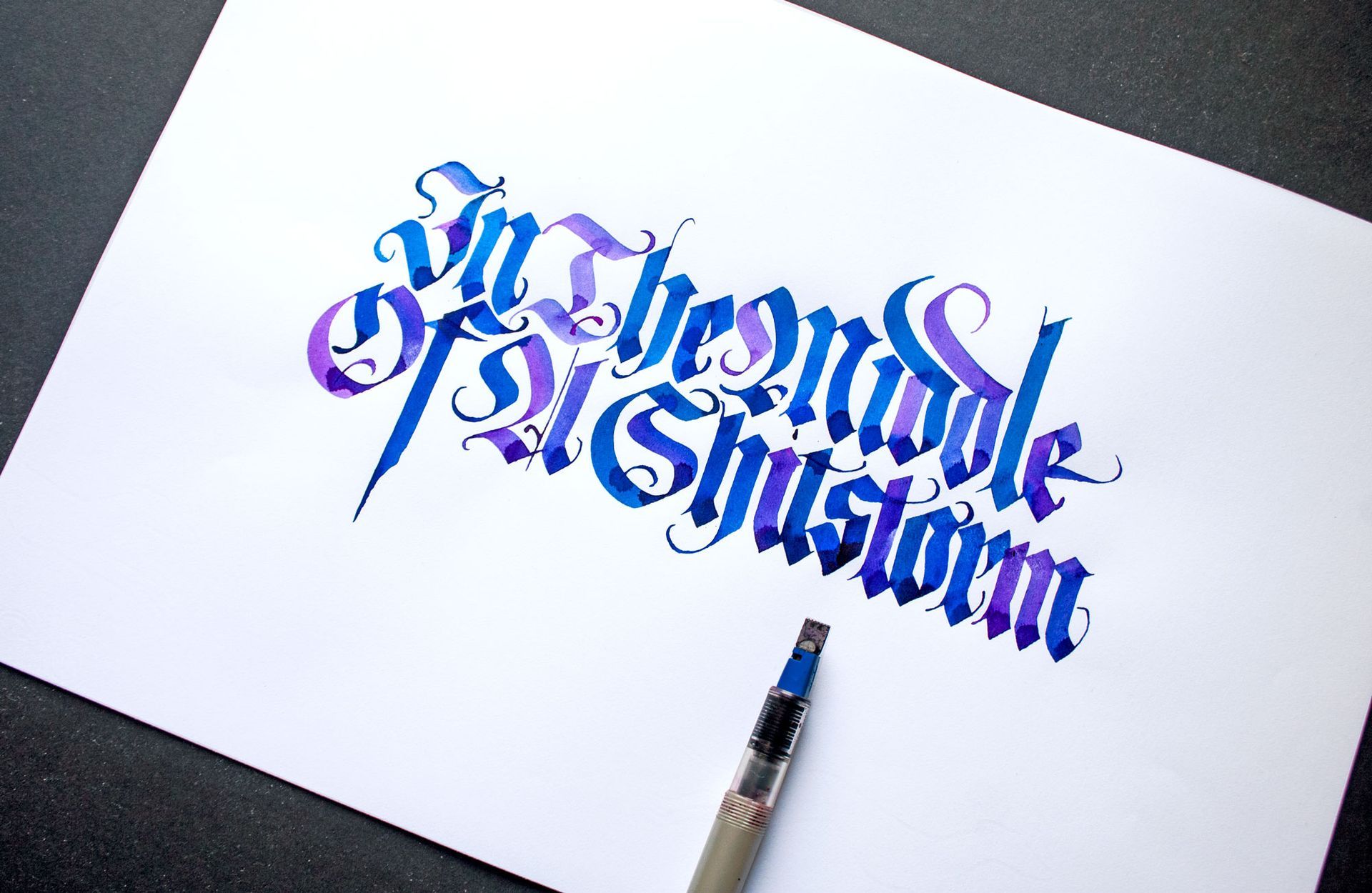 Calligraphy on white paper reading